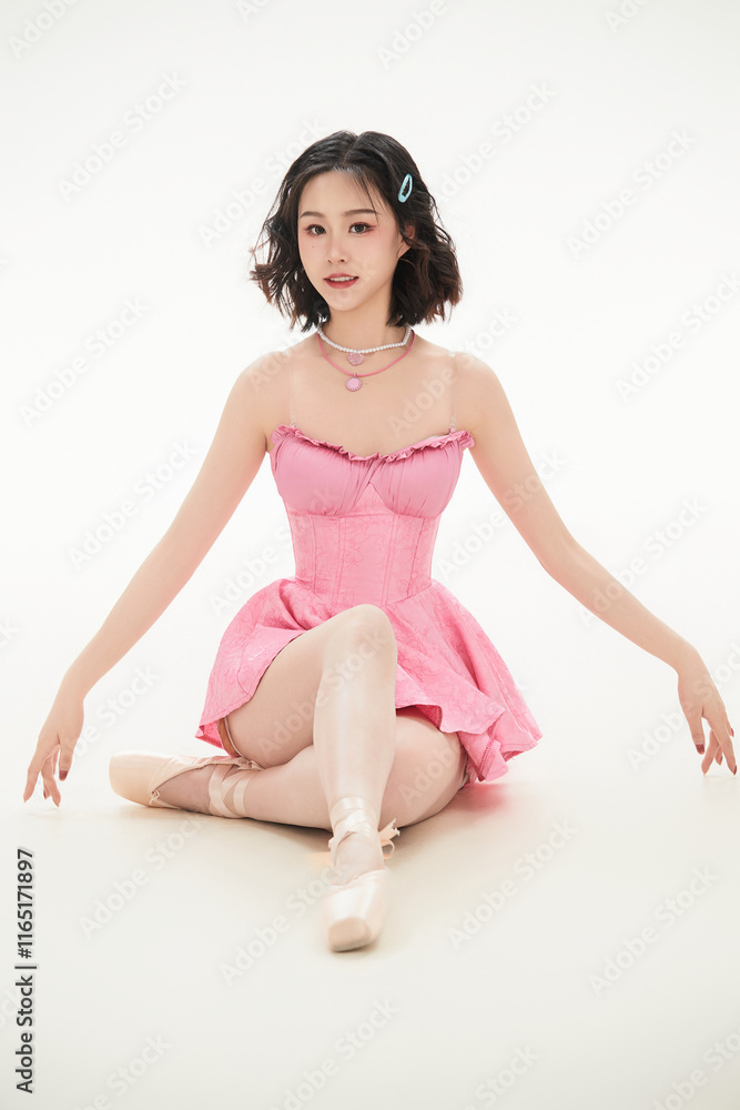 Naklejka premium Asian girl dancing in pink ballet costume