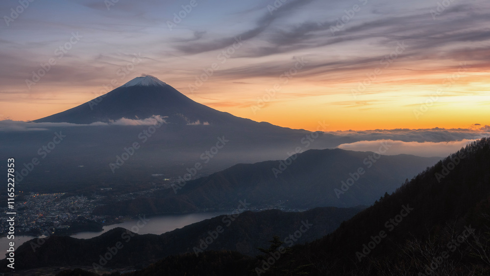 Beautiful sunset aerial view of Mount Fuji and Lake Kawaguchi with colorful sky and city, Yamanashi, Japan Beautiful sunset aerial view of Mount Fuji and Lake Kawaguchi with colorful sky and city, Yamanashi, Japan