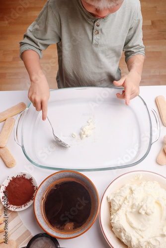 A kid’s touch in dessert preparation photo