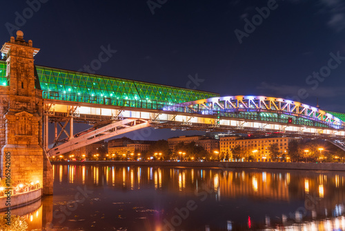 Pushkinskiy bridge with night illumination. Bridge to Gorky Park. photo