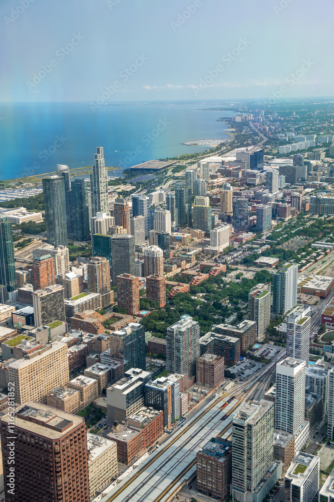 Obraz premium Chicago, IL - July 24, 2024: Aerial view of Chicago skyline. Skyscrapers and city landmarks
