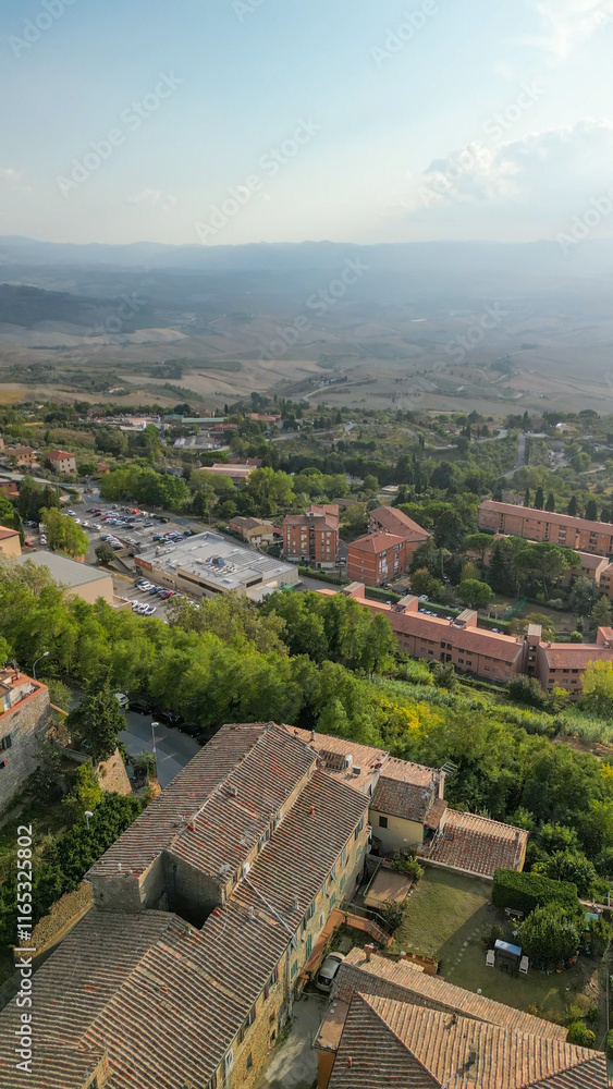 Breathtaking aerial shot of Volterra, Tuscany, with a vibrant sunset sky Breathtaking aerial shot of Volterra, Tuscany, with a vibrant sunset sky