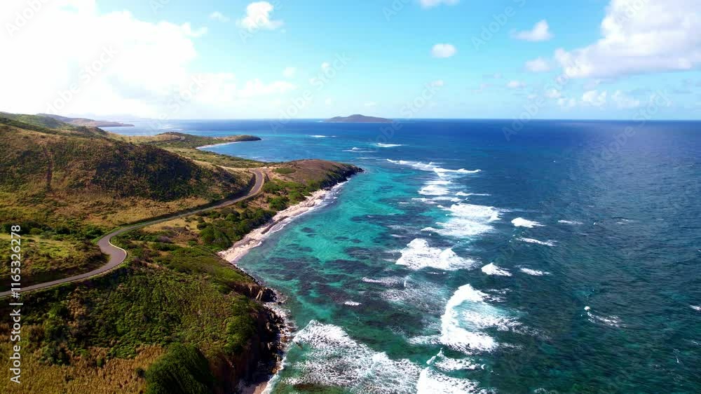 Coastal road along the ocean with rolling waves and blue skies Coastal road along the ocean with rolling waves and blue skies
