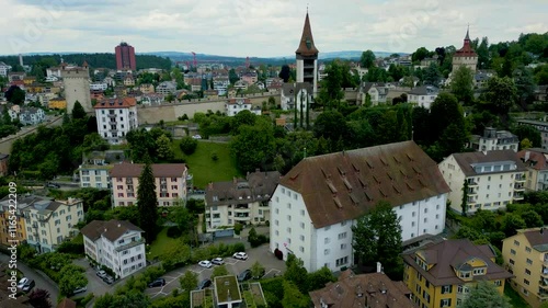 4K Drone Video of the Historic Homes at the base of the Luegislandturm Tower on the Musegg Wall in Lucerne, Switzerland photo