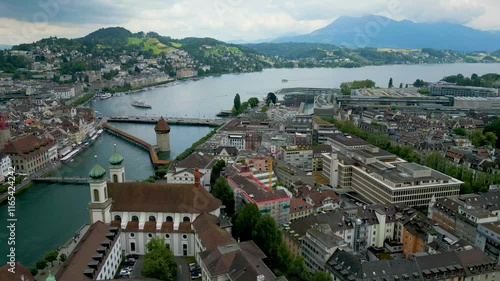 4K Drone Video of the Bridges on the Reuss River and Ferry Terminal on Lake Luzern in Lucerne, Switzerland photo