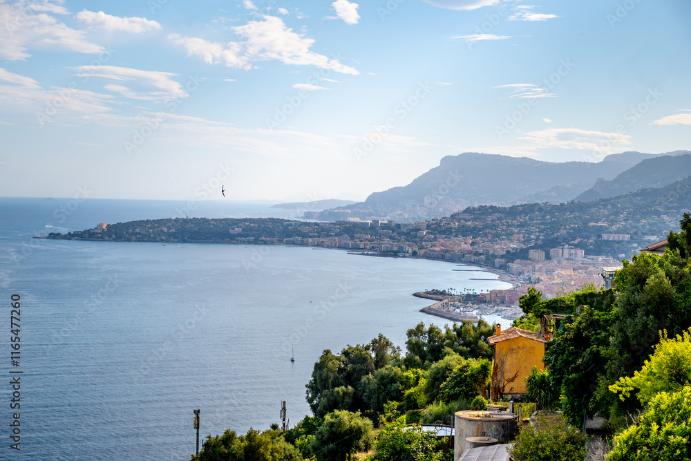 Obraz premium Early morning view on French Riviera, colorful Menton old city and marina on blue Mediterranean Sea near French-Italian border, Monaco, Monte-Carlo, travel destination, panoramic view