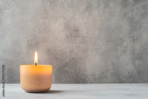 Soft Glowing Candle Flame in Serene Monochrome Studio Setting for Commercial Photo photo