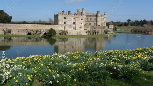  View of Leeds Castle in Kent, UK. Leeds Castle, England, reflection, spring sunny day, with flowers blooming