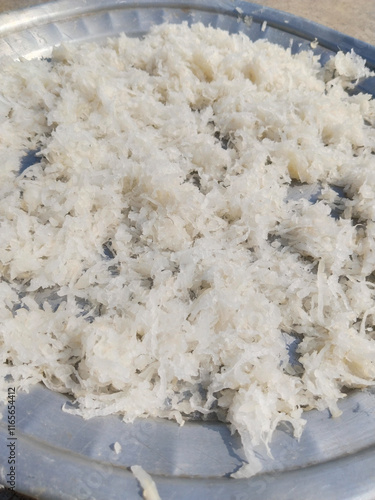 Fresh grated Horseradish on surface background (detailed close-up shot) photo