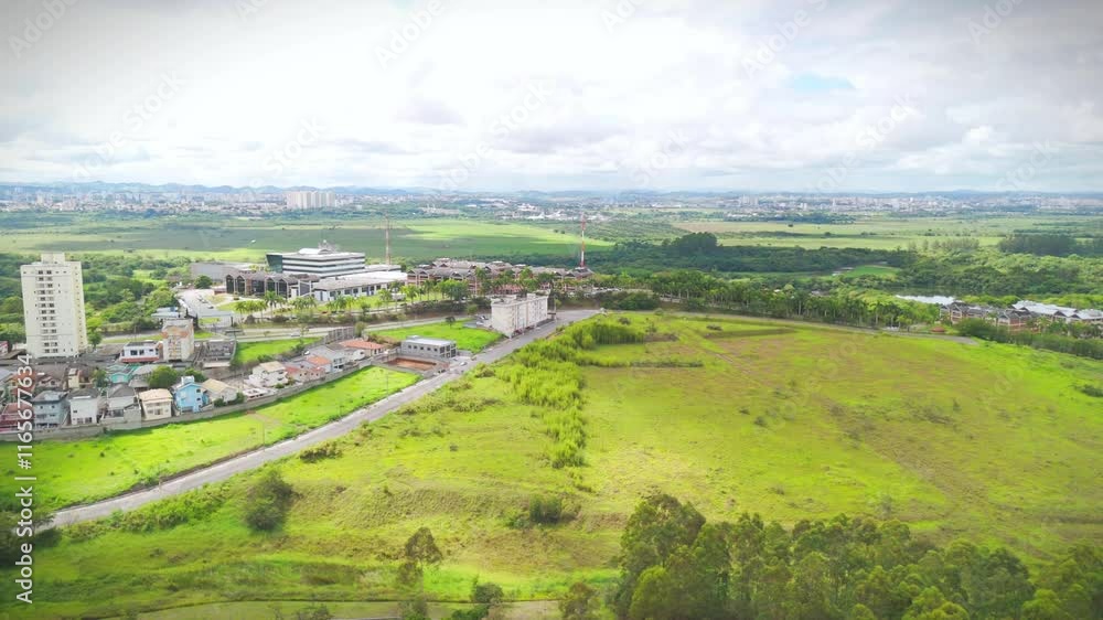 aerial view of a park near downtown of Sao Jose dos Campos, SP. With the city skyline and buildings at distance aerial view of a park near downtown of Sao Jose dos Campos, SP. With the city skyline and buildings at distance
