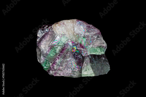 Natural rough rainbow fluorite gemstone on dark background (selective focus)