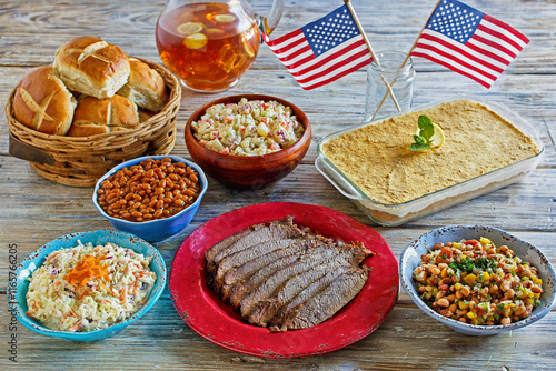 4th of July picnic spread with brisket, coleslaw, baked beans, potato salad, and banana pudding