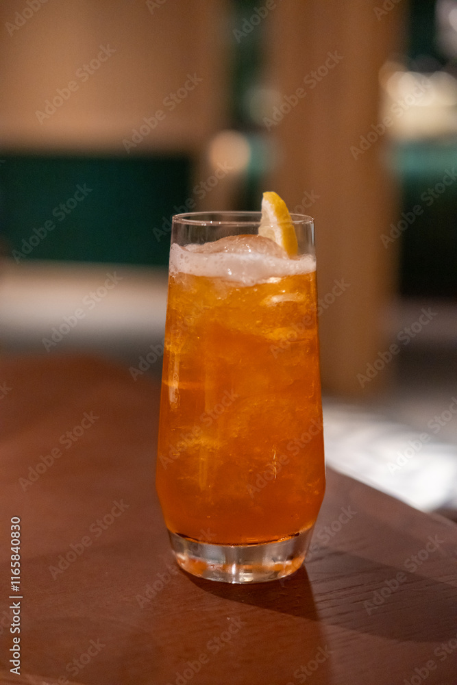 Close up view of orange cocktail on the table with bokeh background Close up view of orange cocktail on the table with bokeh background