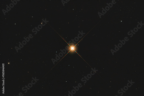 The Aldebaran (alpha Tauri) star in Taurus constellation, taken with amateur telescope. photo