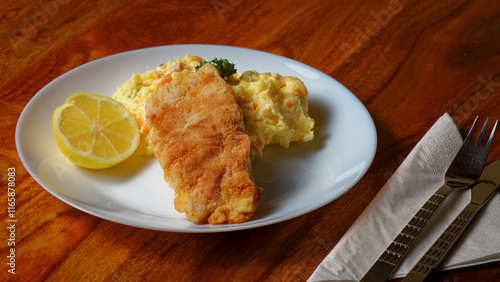 Fried breaded carp fish with potato salad
