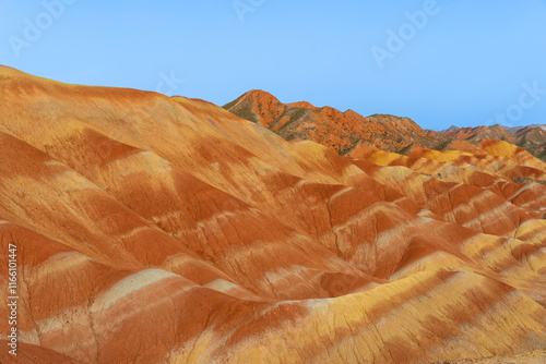 Under the clear sky, the colorful Danxia landforms