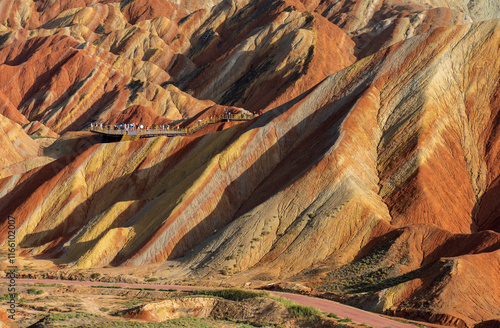 Under the clear sky, the colorful Danxia landforms