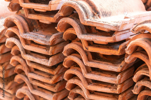 Pile of old clay tiles in a masonry renovation space