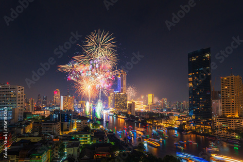 Landscape of Bangkok city with Fireworks, Happy new year countdown 2025 at the Chao Phraya River, Thailand.