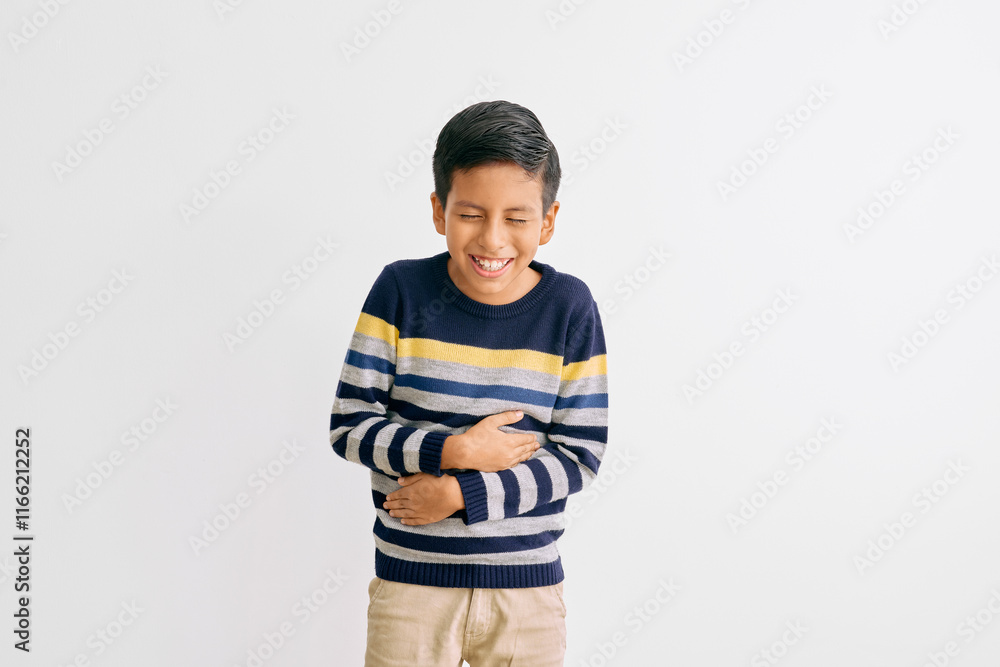 Boy wearing a blue and yellow striped sweater laughing with closed eyes and a genuine expression. The white background highlights his natural and happy moment Boy wearing a blue and yellow striped sweater laughing with closed eyes and a genuine expression. The white background highlights his natural and happy moment