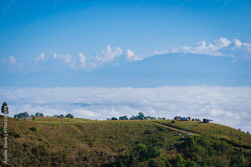 Obraz premium Beautiful natural scenery of cloudscape the sea of mist in the morning at Doi Ba Lu Kho Mountain View Point Campground at Mae Chaem, Chiang Mai, Thailand. Background Happy holiday recreation.