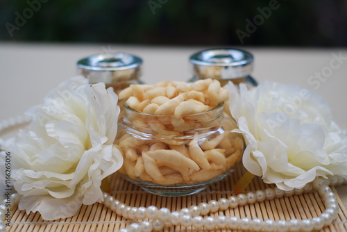 telur gabus sticks in a jar on wooden table