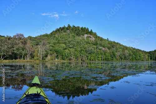 SEPAQ Orford national park kayak exploration of Cherry pond and Serpentine hill on the background. Etang aux cerises and coline Serpentine with yellow kayak