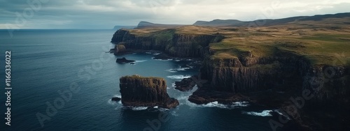 A breathtaking aerial perspective of rugged sea cliffs and natural arches along the coast of Isle of Skye, Scotland, Isle of Skye coastal cliffs scene photo