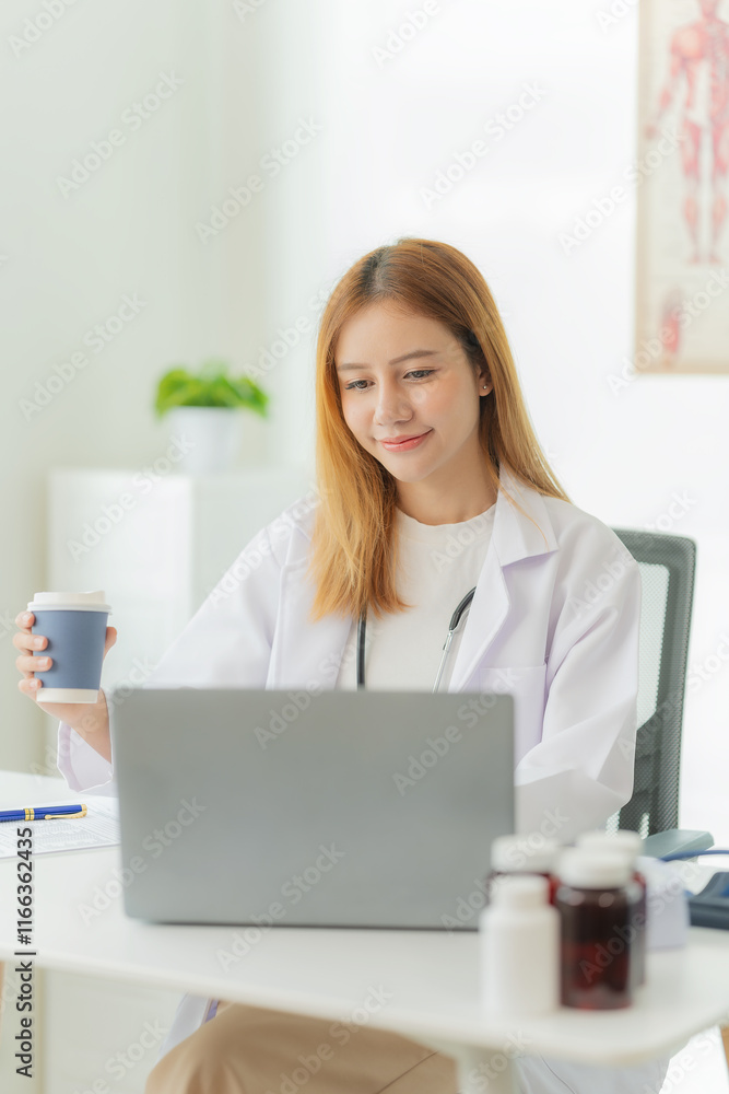 Asian female doctor working with laptop Convenient online consultation for patients Sitting at the clinic table Provide online health consultation vertical picture Asian female doctor working with laptop Convenient online consultation for patients Sitting at the clinic table Provide online health consultation vertical picture