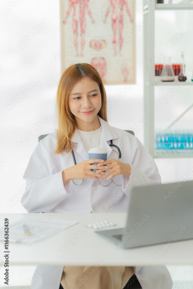 Asian female doctor working with laptop Convenient online consultation for patients Sitting at the clinic table Provide online health consultation vertical picture Asian female doctor working with laptop Convenient online consultation for patients Sitting at the clinic table Provide online health consultation vertical picture