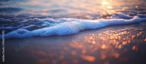 Golden Sunset Waves: Serene Coastal Foam and Warm Light photo