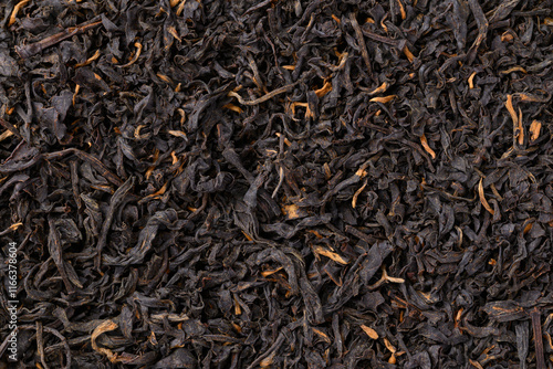 Dried black tea leaves texture background, Close up, Top view