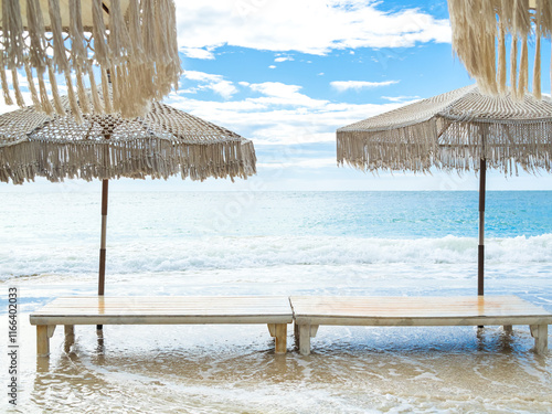 Table on beach sand sea with chair and parasol background shore water blue sky season summer tropical ocean travel nature, mockup display for presentation aesthentics beauty promotion product. photo