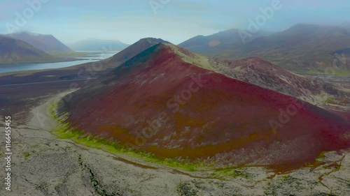 Aerial view of red crater next to north Atlantic ocean in the highlands of Selvallafoss waterfall area, Iceland. photo