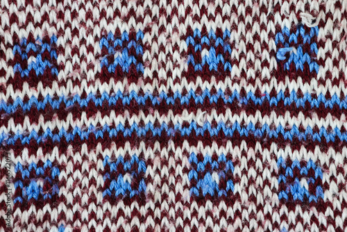 Schilderij op canvas Blue Scandinavian snowflake - knitted wool pattern, close-up