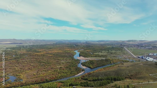 Stunning fall foliage in Erguna Wetland Park showcasing vibrant colors and winding river photo