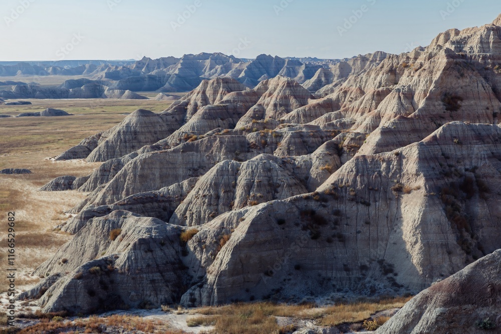Obraz premium Dramatic Badlands landscape, South Dakota. Eroded earth formations, nature's artistry. Badlands National Park, Interior, South Dakota, USA.