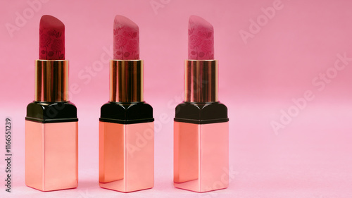 Multi Lipstick on pink background. photo