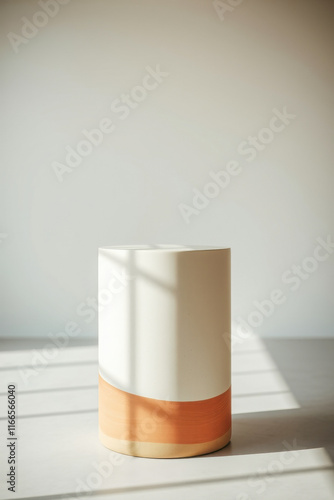 cylindrical ceramic pedestal with light brown accents