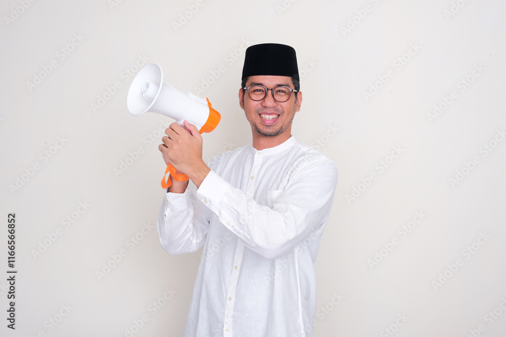 Muslim man smiling happy while holding a megaphone Muslim man smiling happy while holding a megaphone
