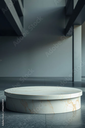 circular white marble pedestal on gray floor