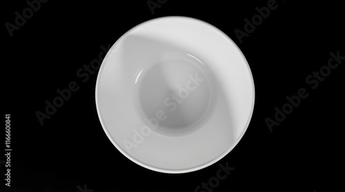 white circular dish on black background