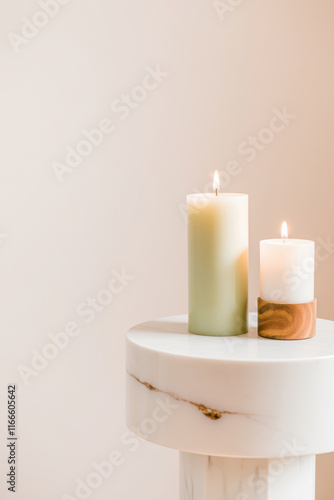 lit candles on marble pedestal