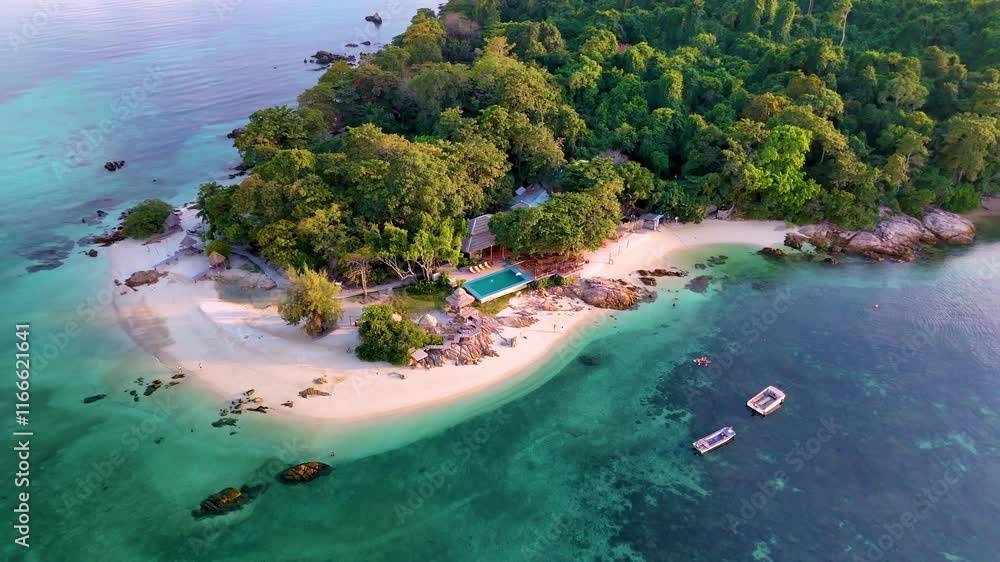 Explore the idyllic shores of Koh Munnork Island, where lush greenery meets tranquil waters. Experience relaxation on a secluded beach surrounded by natures splendor, ideal for a peaceful getaway.