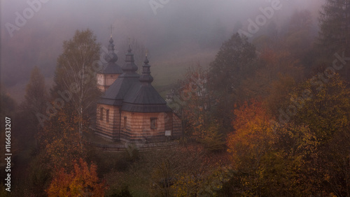 Fototapeta Naklejka Na Ścianę i Meble -  Breathtaking Drone Perspective of Wooden Orthodox Church in Carpathian Mountain