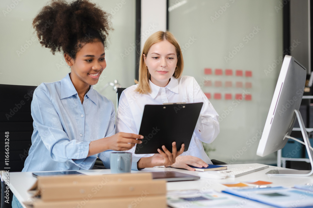 Obraz premium Diverse professionals collaborate on project analysis with financial graphs. Strategic teamwork and insights drive company growth and success.