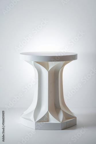 modern white pedestal table with a geometric base