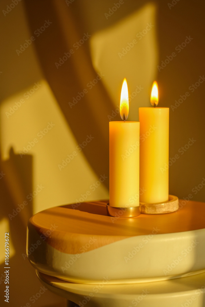 illuminated yellow candles on round table illuminated yellow candles on round table