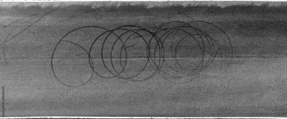 Aerial top view car tire mark from car skid mark, Car tire on asphalt road race track, Texture and background car wheel tire mark on asphalt road