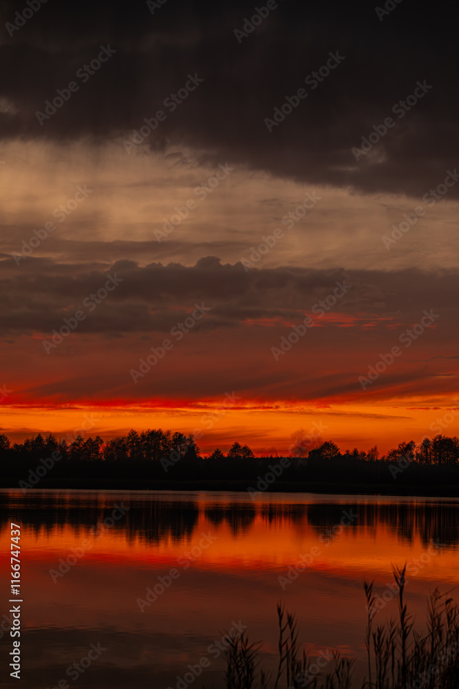 Breathtaking and Stunning Sunset Over the Tranquil Lake Surrounded by Beautiful Reflections Breathtaking and Stunning Sunset Over the Tranquil Lake Surrounded by Beautiful Reflections